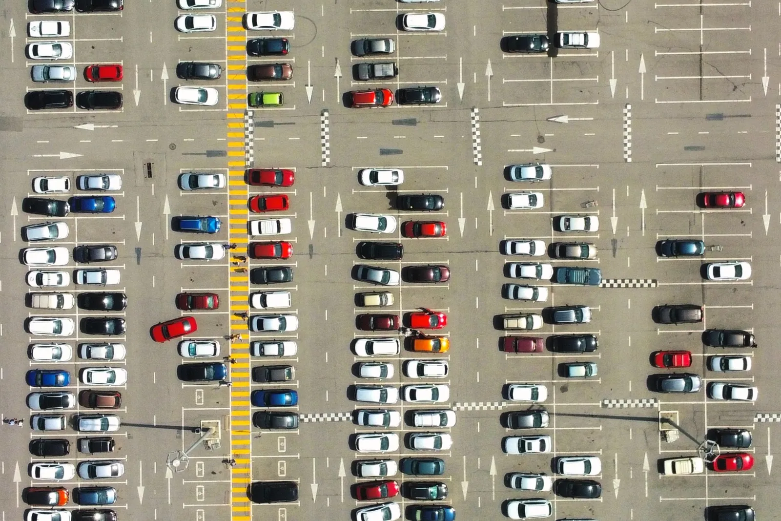 Aerial view of cars filling a parking lot grid, representing lead generation that fills the right spaces with qualified demand